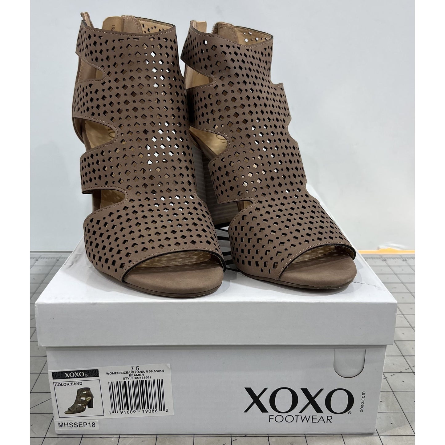 XOXO Women's Casual Boots Sand - Sand Perforated Peep-Toe Beamer Ankle Boot - Women